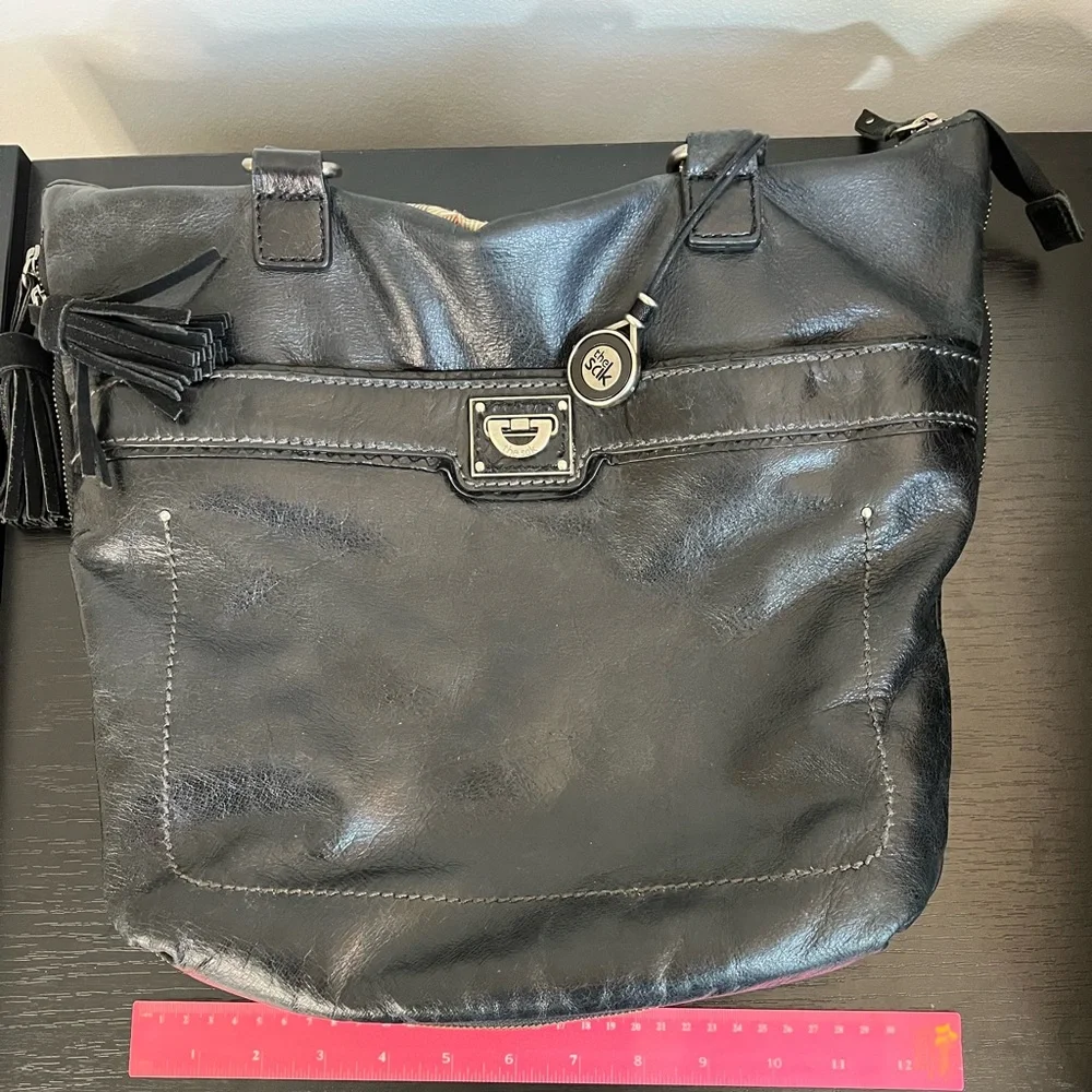 The Sak Expandable Black Leather Suede Shoulder Tote Bag with Suede Tassels